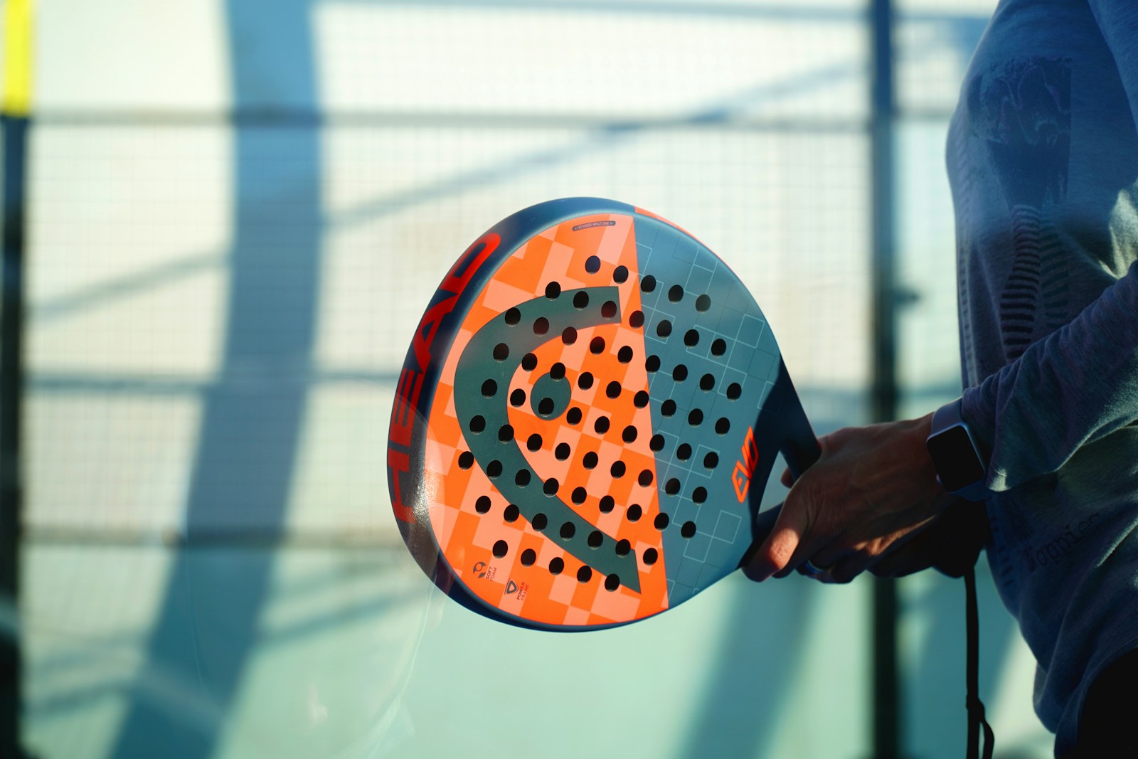 A padel court mid-rally